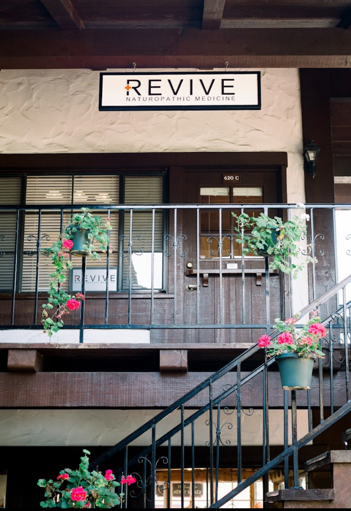 Front door of Suite C with the Revive sign above